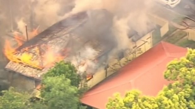 Firefighters are working to control a blaze at Ashgrove in Brisbane's north-west.