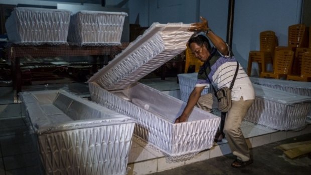 A man prepares coffins ahead of executions of death row inmates in coming days.
