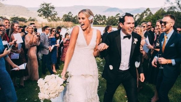 After posting a shot holding hands and a drone video, Jeffreys followed suit with an intimate snap showing the pair walking through guests at the end of the ceremony in her Rebecca Vallance dress. She captioned the image "So much joy with my wonderful husband."