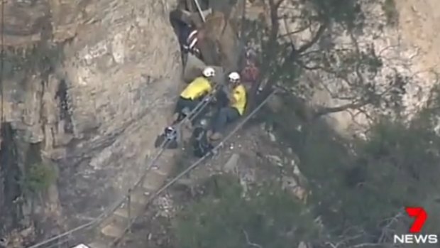A man has died and two others are trapped after an accident at Wentworth Falls. 