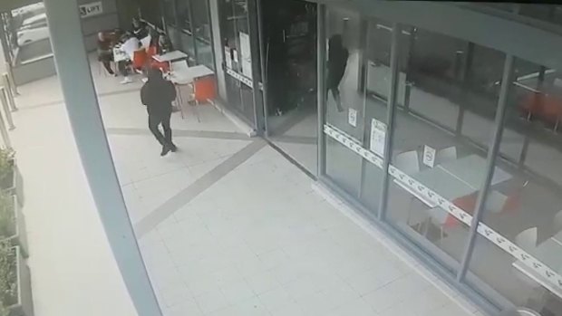 CCTV shows the gunman approaching Walid "Wally" Ahmad at Bankstown.