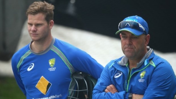 Under the pump: Steve Smith and Darren Lehmann watching the rain at Blundstone Arena.