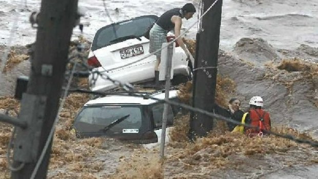 Hannah Reardon-Smith and her mother Kathryn owe their lives to the brave efforts of Toowoomba firefighter Peter McCarron. He struggled against raging waters on Dent St to bring them to safety during the January 2011 floods. 