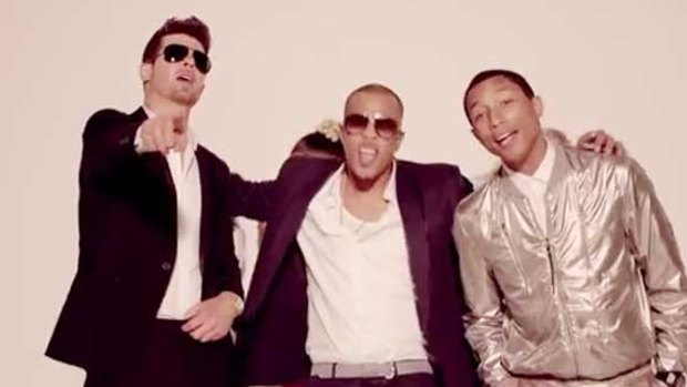 Happier times: Robin Thicke with Pharrell Williams and T.I in the <i>Blurred Lines</i> film clip.