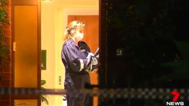 Police inside the Patterson Lakes home on Sunday night.