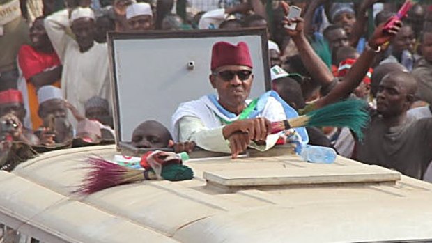 Nigerian presidential candidate Muhammadu Buhari party rides atop a bus in Kano.