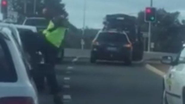 The man kicking Mr Mathew's car in a bout of road rage in Canberra.