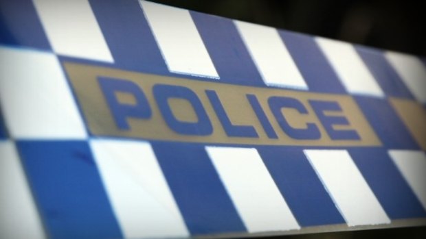 A man will face charges after he allegedly headbutted one police officer and spat blood at another.