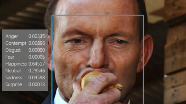 The app registered former prime minister Tony Abbott's expression as happy as he ate an onion.