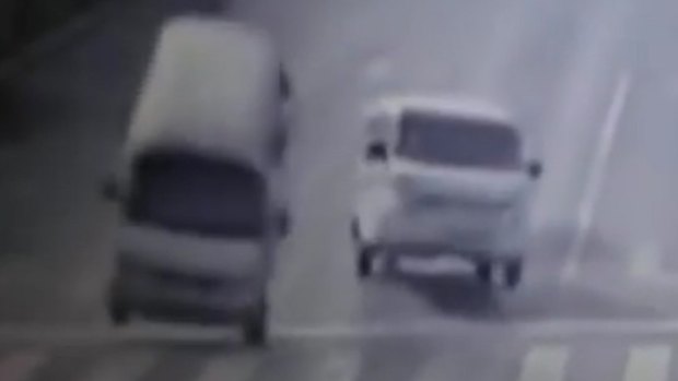 Vehicles appear to levitate in this screen grab from a video clip of a crash in China.