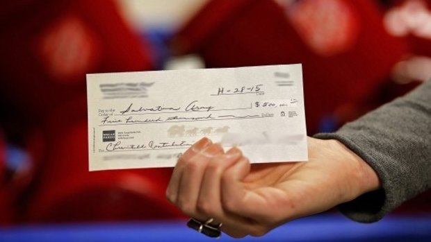 Giving back ... A couple has anonymously donated $US500,000 to the Salvation Army by placing this cheque in a donation kettle in Minneapolis.
