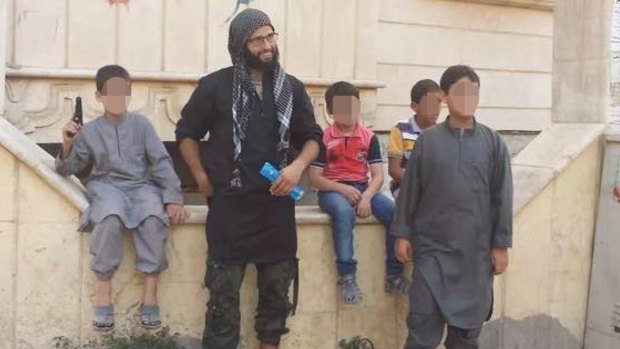 Mahmoud Abdullatif poses with children in Syria.