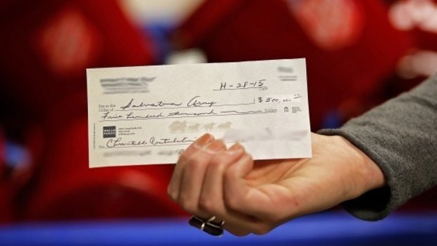 Consigned to history: New electronic funds transfer systems will mean the days of writing out big cheques will be over for most people.