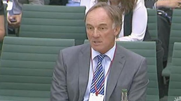 Former <i>News of the World</i> lawyer Tom Crone, pictured here giving evidence to a UK parliamentary inquiry.