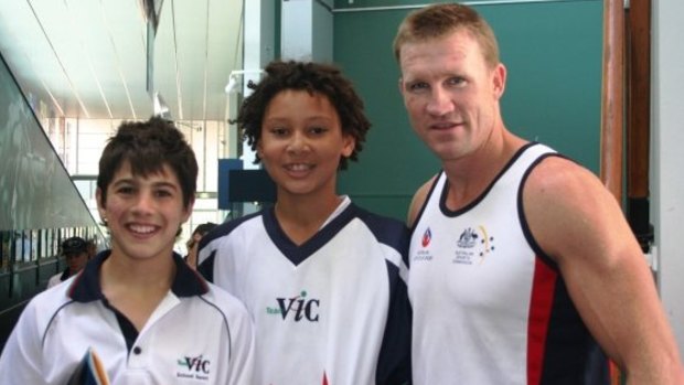 Stars of the future and young temammtes Christian Petracca and Ben Simmons with Collingwood coach Nathan Buckley. 