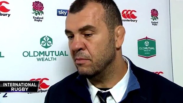 Unhappy: Wallabies coach Michael Cheika argues with a beINsports reporter at Twickenham.