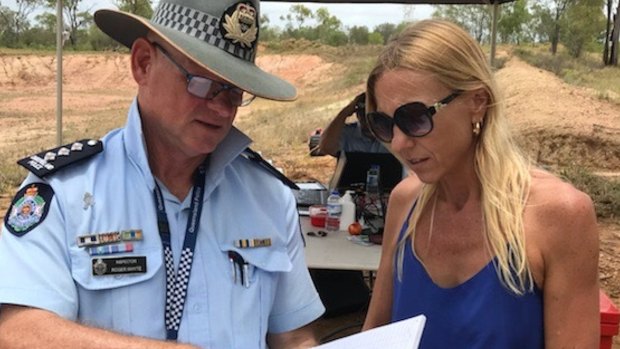 Rachel Penno, mother of missing Newcastle man Jayden Penno-Tompsett, speaks with police at Charters Towers.