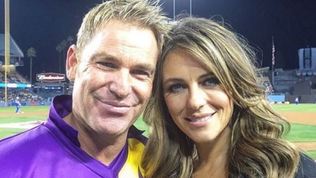 Let’s just be friends: Shane Warne and Elizabeth Hurley shared a warm embrace in front of the crowd at the Cricket All-Star tournament in Los Angeles on Saturday.