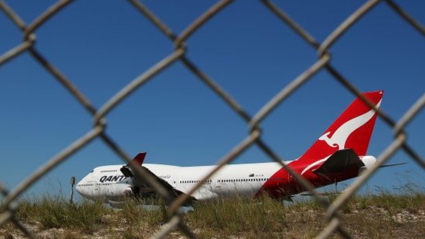 A woman reportedly drove through a fence onto a runway at Brisbane Airport.