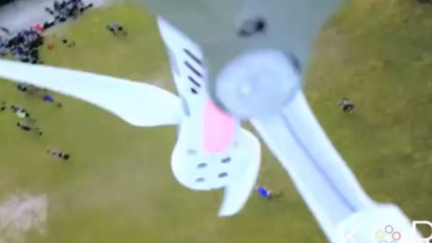 The drone spins and falls to the ground after being hit by a ball. 