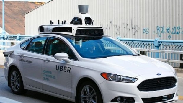 One of Uber's test self-driving cars on the road in Pittsburgh.