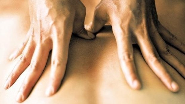 A Brisbane massage therapist has admitted assaulting 16 women and five girls.