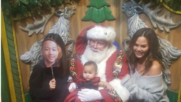 Chrissy Teigen, right, poses with her 8-month-old daughter Luna and a couple of other familiar faces.