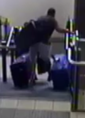 This dad takes a tumble at Leppington, carrying three suitcases.