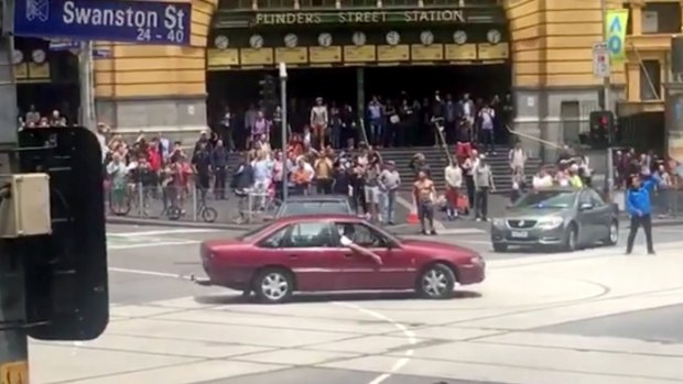 The Holden Commodore was seen doing burnouts outside Flinders St station in the lead-up to the tragedy.