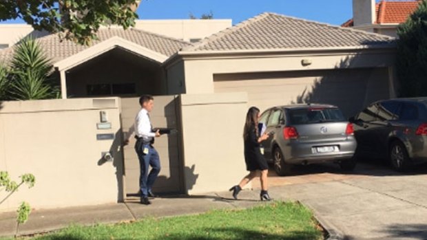 Detectives leave the Ristevski's family home on Tuesday.