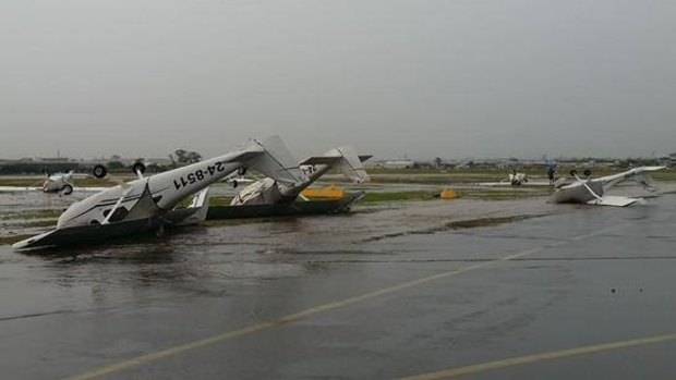 Violent storm lashes Brisbane on Thursday, November 27. Plane overturned at Archerfield.