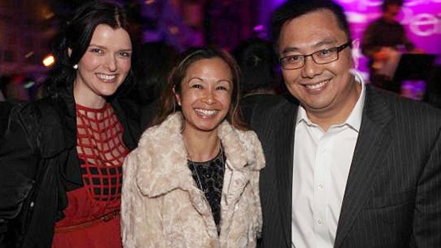 Amber Harrison (left), with her boss Nick Chan and his wife Peggy. Chan was responsible for approving Harrison's $500,000 in expenses over five years.