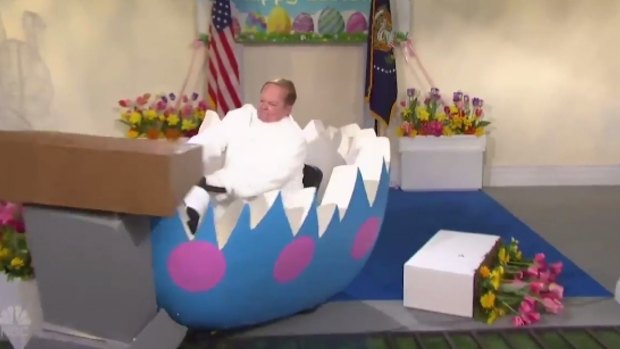 Melissa McCarthy as Sean Spicer driving an egg-shaped golf cart over the podium in a skit on <em>Saturday Night Live</em>.