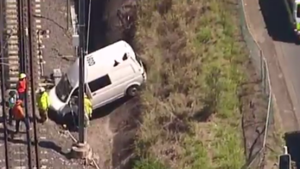 The van crashed through a fence onto train tracks at Fairfield.