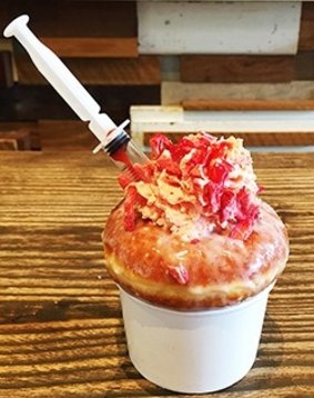 Whisky Creamery serves desserts with syringes full of sauces and toppings.