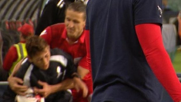 Michael Marrone grabbing the ball boy during the FFA Cup final against Sydney FC.