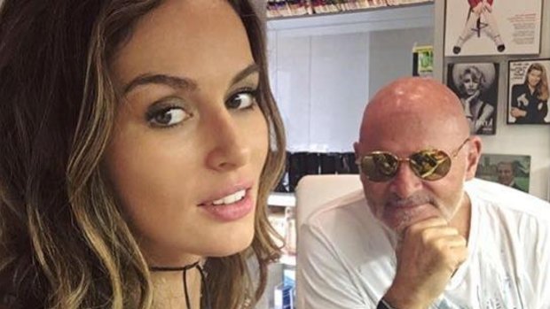 Dr David Carr, pictured with model Nicole Trunfio, has had his contract terminated.