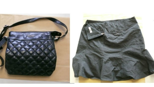The woman's handbag and skirt.