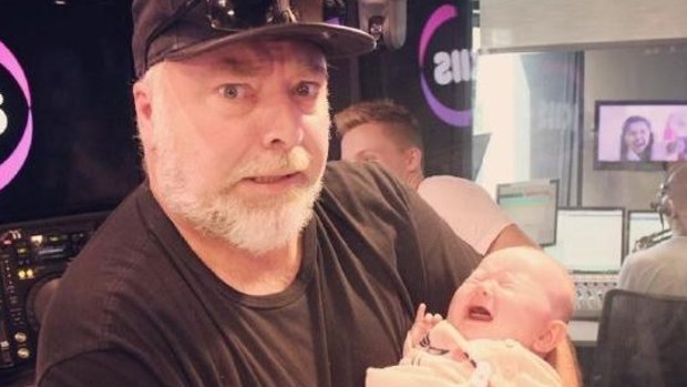 Kyle Sandilands with Michael and Kyly Clarke's baby, Kelsey Lee, last year.