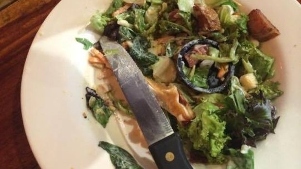 A Hog's Breath Cafe customer has found a sink plug in a salad.