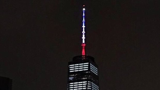 One World Trade Centre is illuminated in the colours of the French flag.