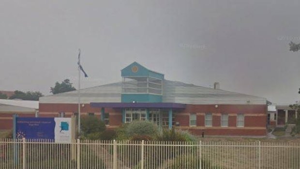 The arrested woman allegedly attacked a car in the car park of Ballarat Specilasit School.