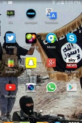 A wallpaper image from the boy's mobile phone showing Islamic State fighters.