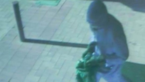 Image of Rivett Post Officer Offender - Note: The CCTV colour is poor and the actual clothing is darker than appears on CCTV.