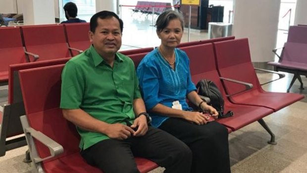Respected Cambodian opposition figure Mu Sochua, right,  in the departure hall of Phnom Penh's airport before leaving the country, saying she had been told her arrest was imminent. 