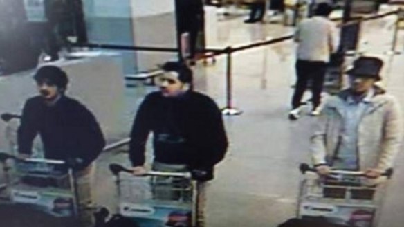 Nam Laachraoui, left captured on CCTV, moments before the blast with two other bombers. 