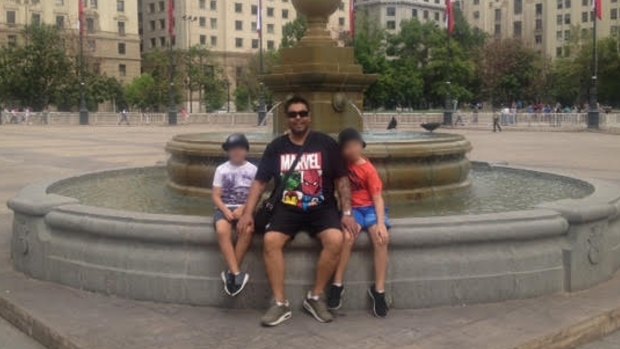 Ricardo Bolvaran with his two children in Santiago. They will soon return to Australia with their mother.