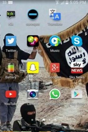 A wallpaper image from the English boy's mobile phone showing Islamic State fighters.