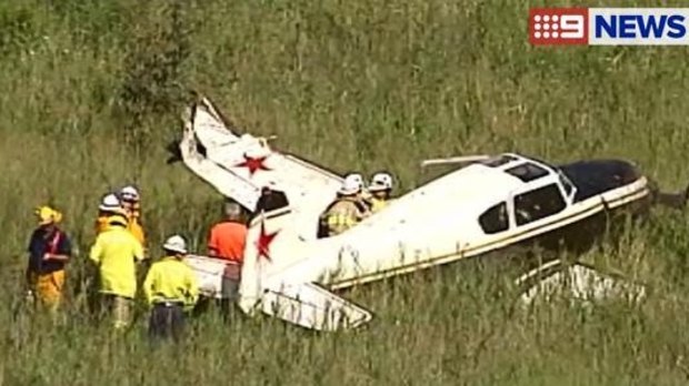 Emergency crews at the scene of a plane crash south of Brisbane.