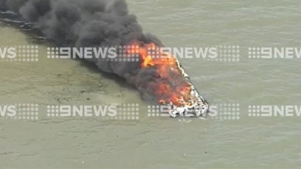 Flames tear through a boat in the southern Moreton Bay.